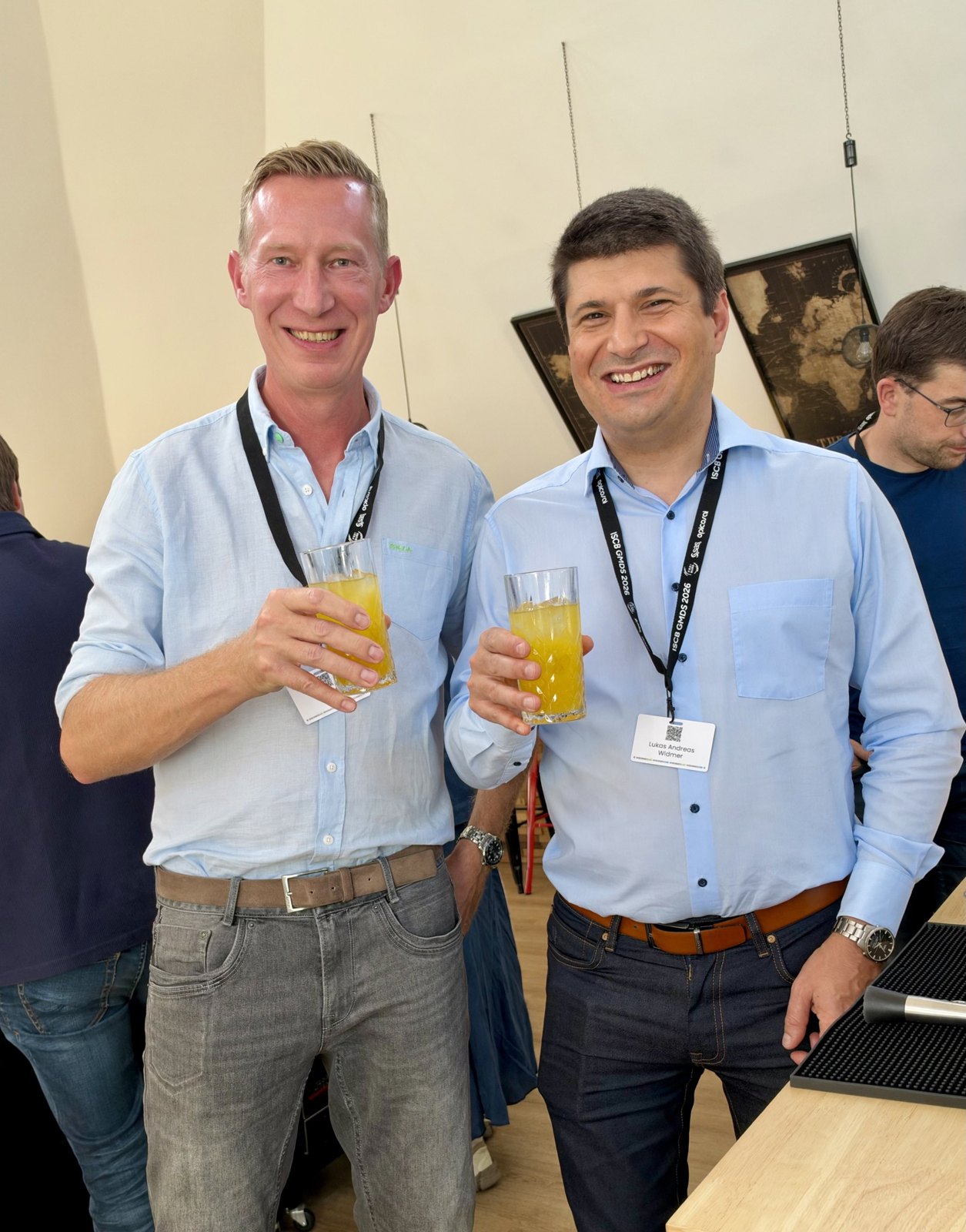Friedrich Pahlke (left) and Lukas Widmer from Novartis (right) at a conference social gathering.